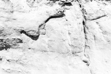 Texture of a yellow stone rock. Abstract background for design.の写真素材