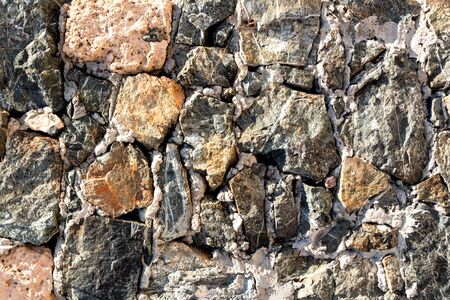 Background of ancient stone wall. Texture of old brick.