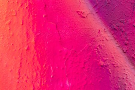 Fragment of colored graffiti painted on a wall. Abstract background for design.