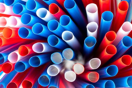 A lot of colored drinking straws, top view.の写真素材