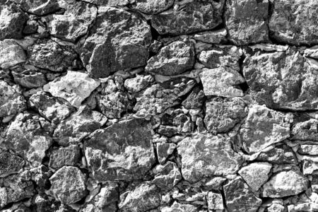 Background of ancient stone wall. Texture of old brick.の写真素材