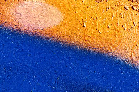 Fragment of colored graffiti painted on a wall. Bright abstract background for design.の写真素材