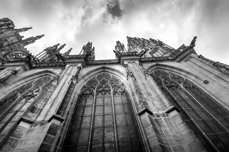 St. Vitus Cathedral in Prague, Czech Republic with a cloudy sky. Overcast weather. Prague Castle. Black and white photo. Monochrome.の写真素材