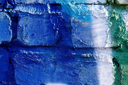 Fragment of colored graffiti painted on a brick wall. Bright abstract background for design.の写真素材