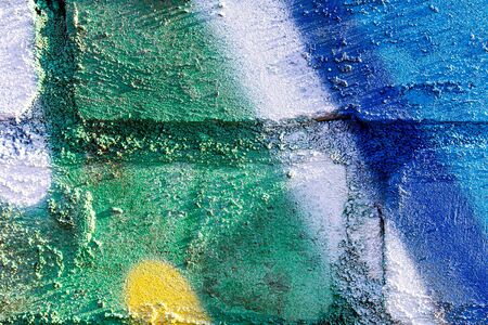 Fragment of colored graffiti painted on a brick wall. Bright abstract backdrop for design.の写真素材