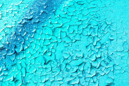 Fragment of colored graffiti with peeling paint on a wall. Bright abstract background for design.の写真素材