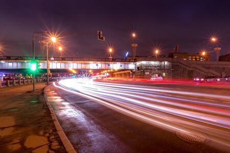 Moving car with blur light through city at night. Moscow, Russia.
