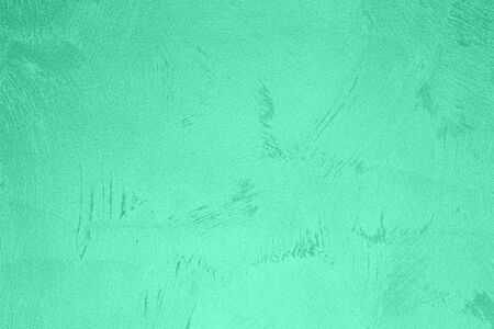 Texture of green decorative plaster or concrete. Abstract background for design. Art stylized banner with copy space for text.の写真素材