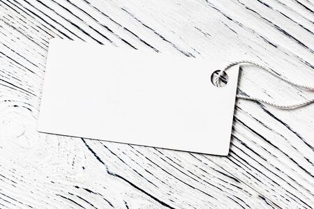 White label on a wooden table. Abstract background for design. Art stylized baner or mock up with...