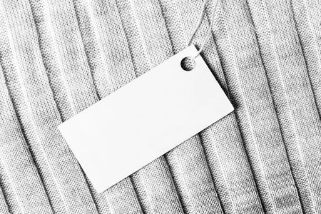 White label on a woolen fabric. Abstract background for design. Art stylized baner or mock up with...