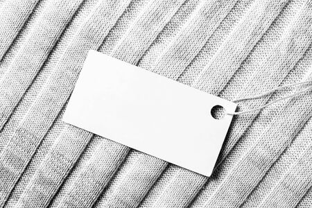 White label on a woolen fabric. Abstract background for design. Art stylized baner or mock up with copy space for a text.の写真素材