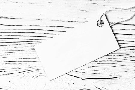 White label on a wooden table. Abstract background for design. Art stylized baner or mock up with...