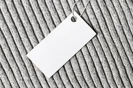 White label on a woolen fabric. Abstract background for design. Art stylized baner or mock up with...