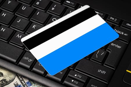 Dollar bills, black keyboard and debit card with copy space for a text. The concept of electronic money and commerce. The concept of buying things on credit. Background or mock up for design.の写真素材