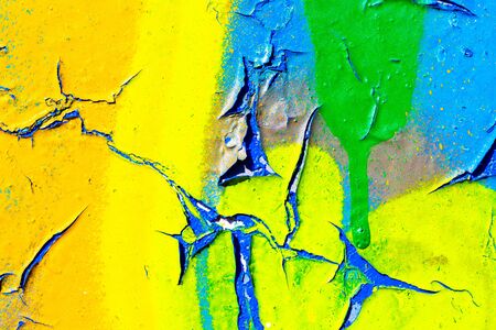 Fragment of colorful graffiti painted on a concrete wall. Bright yellow and green abstract...