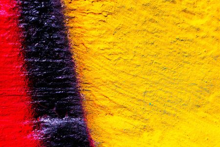 Fragment of colorful graffiti painted on a concrete wall. Bright abstract background for design.の写真素材