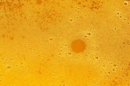 Texture of foam in light beer. Abstract backdrop for design.の写真素材