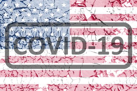 USA flag on cracked peeling off cracked paint texture. The concept of COVID-19 or coronavirus...