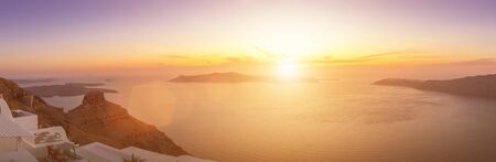 Seascape of sunset overlooking the caldera and the sea in the village of Imerovigli on the island of Santorini in the summer. Greece. Panorama.の写真素材