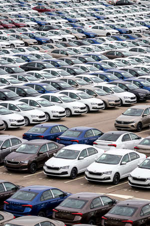 Volkswagen Group Rus, Russia, Kaluga  - MAY 24, 2020: Rows of a new cars parked in a distribution...