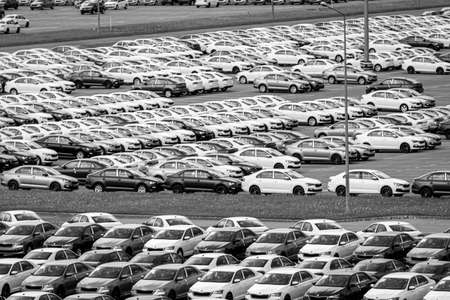 Volkswagen Group Rus, Russia, Kaluga  - MAY 24, 2020: Rows of a new cars parked in a distribution center. Top view to the parking in the open air.のeditorial素材