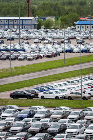 Volkswagen Group Rus, Russia, Kaluga  - MAY 24, 2020: Rows of a new cars parked in a distribution...