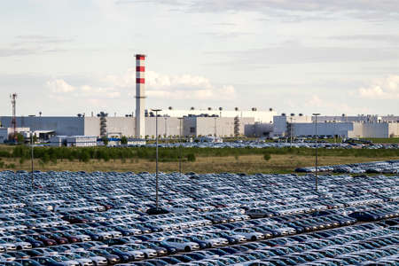 Volkswagen Group Rus, Russia, Kaluga - MAY 25, 2020: Rows of a new cars parked in a distribution center. Parking in the open air.のeditorial素材