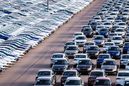 Volkswagen Group Rus, Russia, Kaluga - MAY 25, 2020: Rows of a new cars parked in a distribution center. Parking in the open air.のeditorial素材