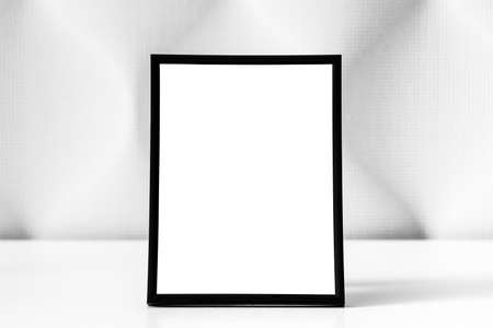 White wooden floor and black photo frame with copy space for a text background. Mock up for design.の写真素材