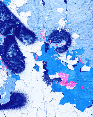 Fragment of colored graffiti painted on a wall. Bright abstract background for design.の写真素材