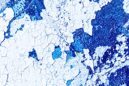 Fragment of colored graffiti painted on a wall. Bright abstract backdrop for design with peeling paint.の写真素材