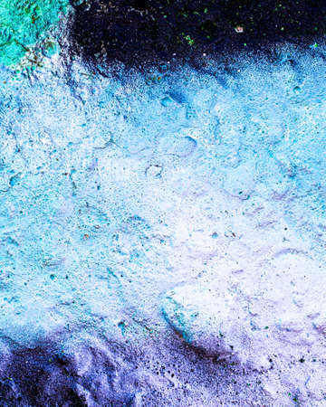 Fragment of colored graffiti painted on a wall. Bright abstract background for design. Spray urban pictures.の写真素材