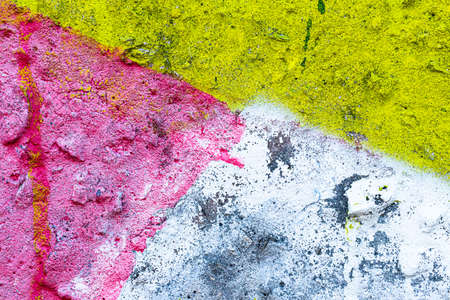 Fragment of colored graffiti painted on a wall. Bright abstract background for design. Spray urban pictures.の写真素材
