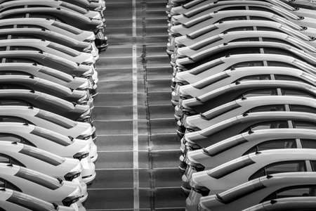 Volkswagen Group Rus, Russia, Kaluga - MAY 24, 2020: Rows of a new cars parked in a distribution center on a day in the spring, a car factory. Parking in the open air. Black and white photography.のeditorial素材