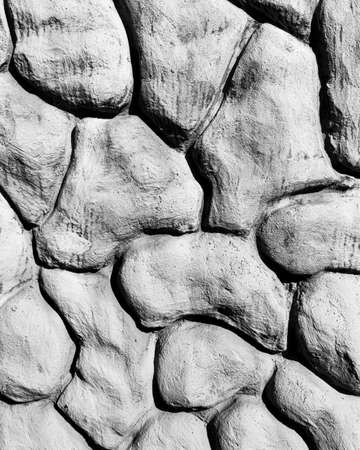 Black and white texture of a wall made of stones. Abstract background for design.の写真素材