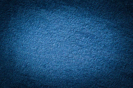 Blue decorative plaster texture with vignette. Abstract grunge background with copy space for design.の写真素材