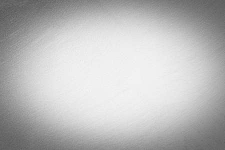 Gray decorative plaster texture with vignette. Abstract grunge background with copy space for design.の写真素材