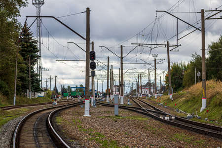 Railway with freight wagons and cisserines on it.