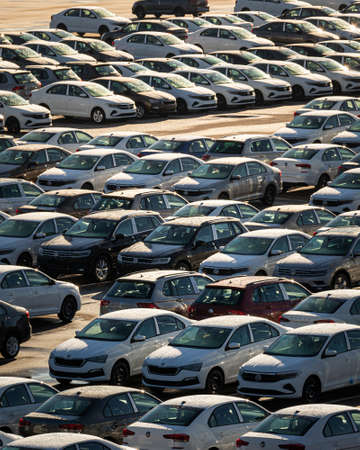 Russia, Kaluga - NOVEMBER 12, 2020: Rows of new cars parked in a factory or dealership parking lot...