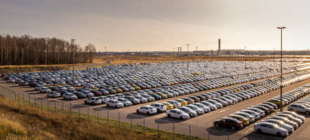 Russia, Kaluga - NOVEMBER 12, 2020: Rows of new cars parked in a factory or dealership parking lot...