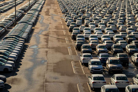 Russia, Kaluga - NOVEMBER 12, 2020: Rows of new cars parked in a factory or dealership parking lot...