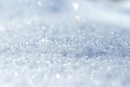 Close-up shot of snow crystals illuminated by sunlight. Winter background.の写真素材