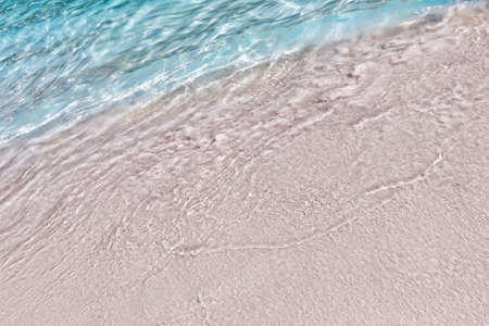 Sea surf on the beach with coral sand in the tropics. Close-up.の写真素材