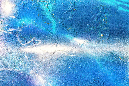 A fragment of colorful graffiti painted on a wall. Abstract urban background for design.