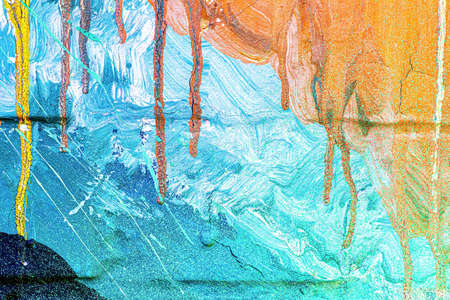 A fragment of colorful graffiti painted on a wall. Abstract urban background for design.