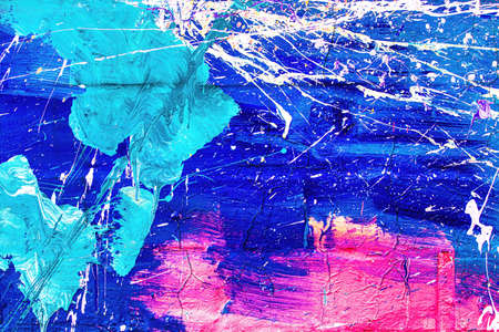 A fragment of colorful graffiti painted on a wall. Abstract urban background for design.
