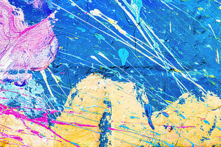A fragment of colorful graffiti painted on a wall. Abstract urban background for design.