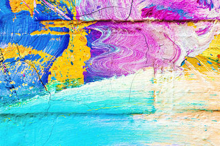 A fragment of colorful graffiti painted on a wall. Abstract urban background for design.の写真素材
