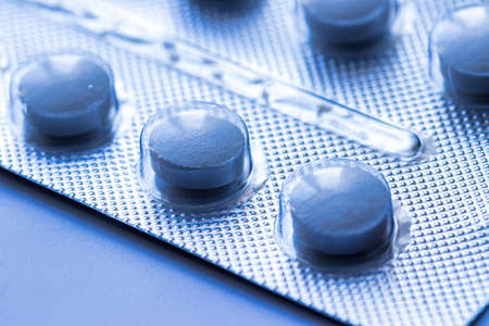 Plate with medical pills close-up.