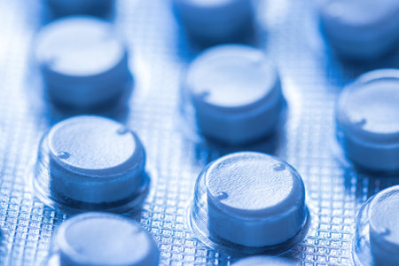 Plate with medical pills close-up.